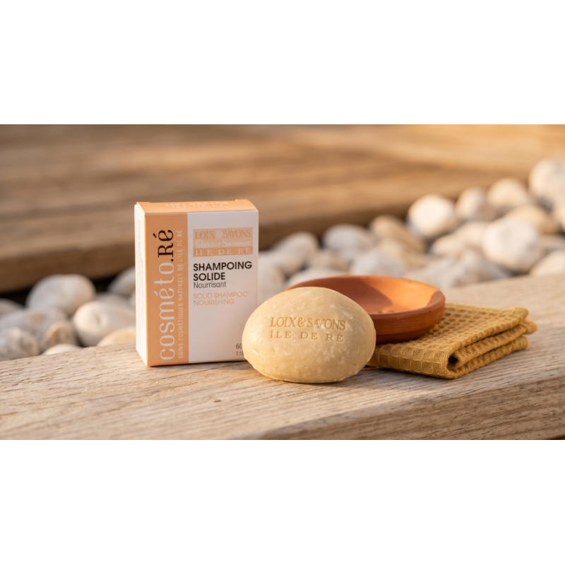 shampoing solide nourrissant cheveux secs galet beige et boite abricot sur bois